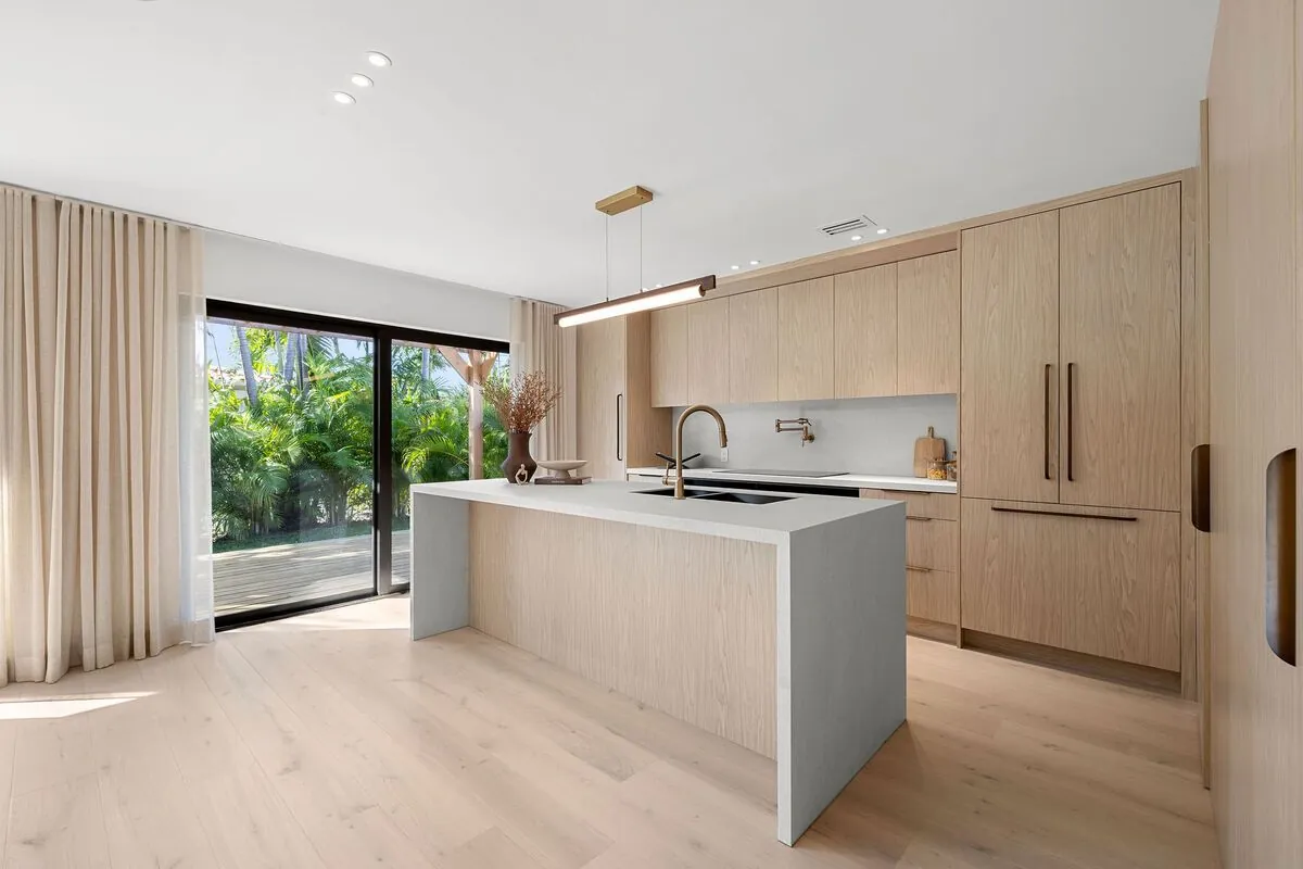 White oak floors in a modern kitchen with a waterfall island